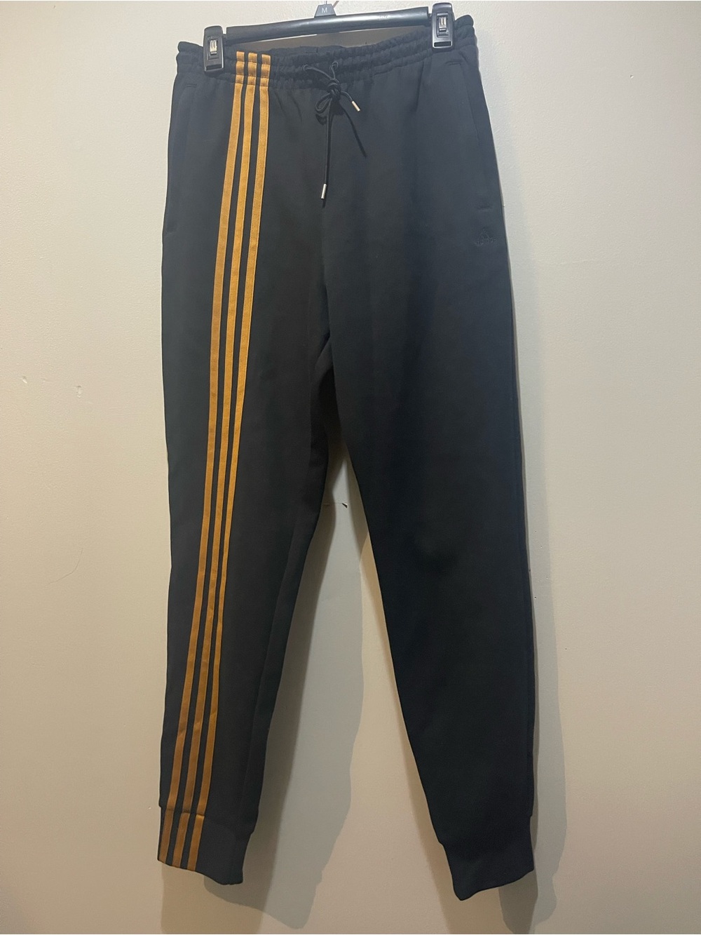 Adidas x Ivy Park Jogger Pants with Gold Stripes